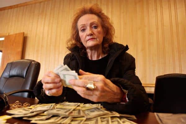 Old woman counting money